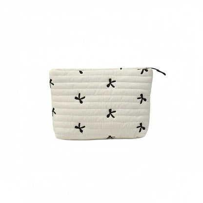 Trousse de Toilette Femme Matelassée avec Broderies Nœuds Ivoire